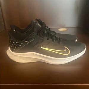 Nike Black and Gold Athletic Shoes with Streamlined Design